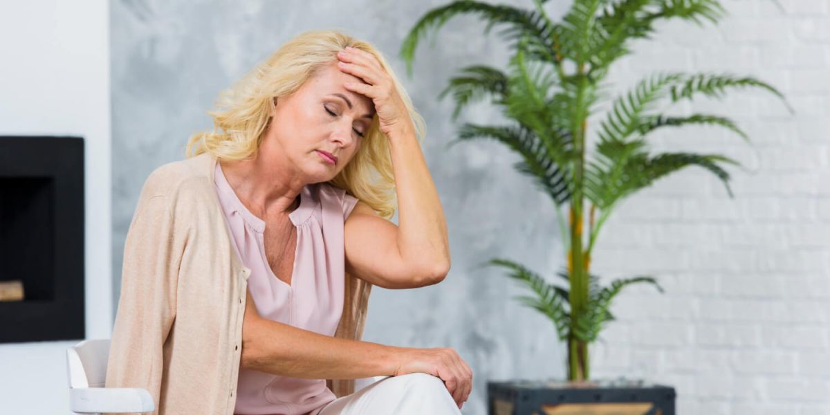Old lady having a headache